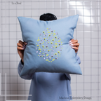 A colorful Easter egg adorned with intricate floral patterns displayed on a pillow