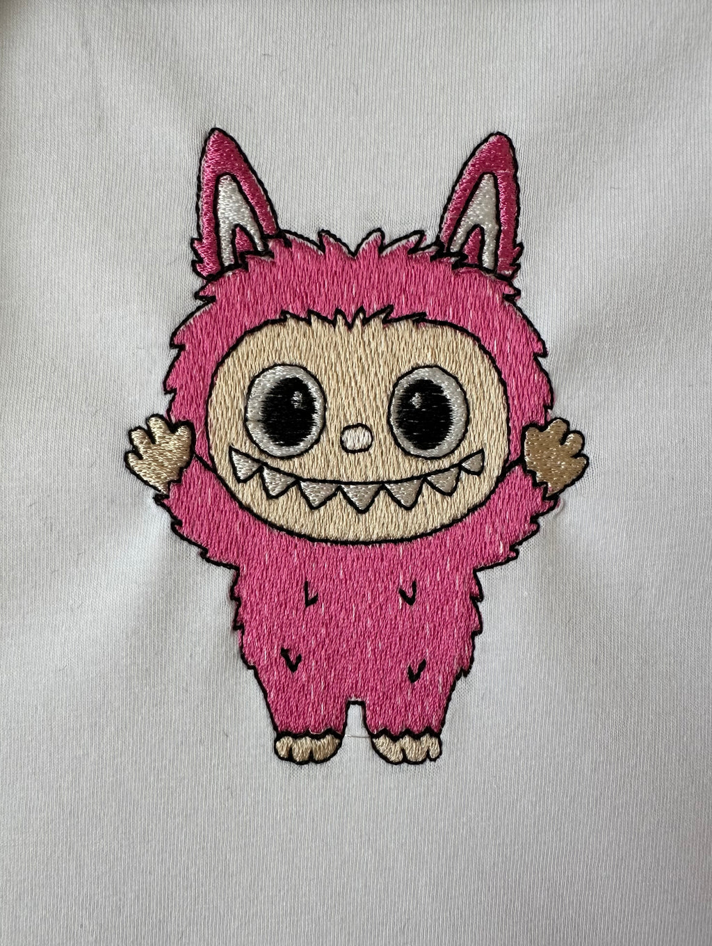 Labubu Machine Embroidery Design in a real
