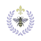  Intricate machine embroidery design featuring a regal bee surrounded by a laurel frame