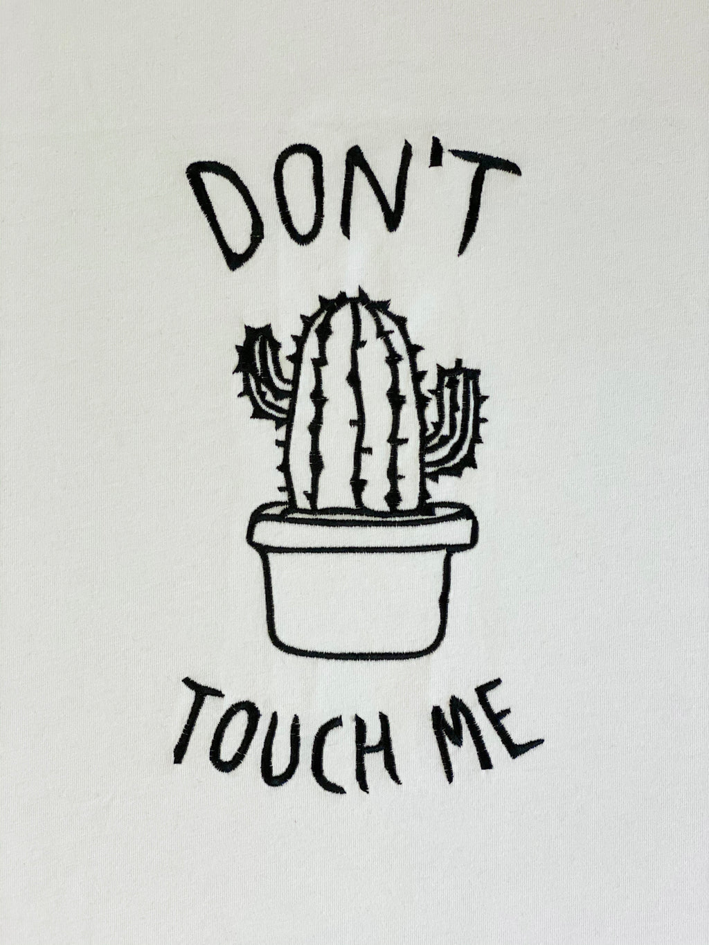 Machine embroidery design depicting a cactus in a pot with 'Don't touch me' text